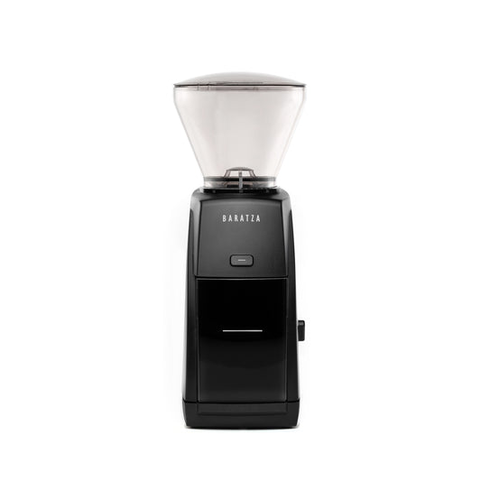 Black coffee grinder with glass container on a white background