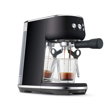 Black espresso machine with two glass cups on a white background