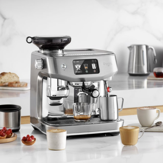 Breville coffee machine on a kitchen counter with various coffee cups and ingredients.